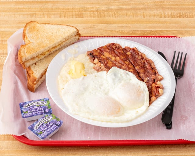 2 Eggs, Grits with Corned Beef Hash or Smoked Ham.